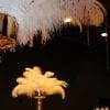 Gold tall arrangements with feathers for gatsby themed event